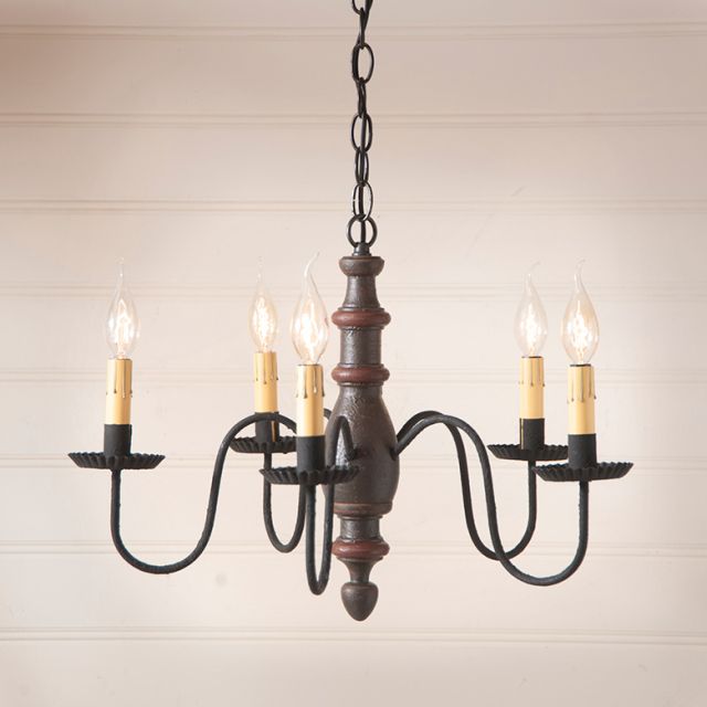 Vintage-style chandelier with five candle-like lights on a neutral background