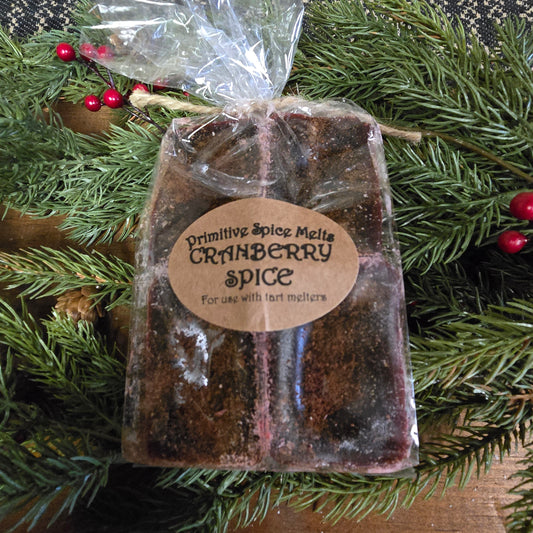 Clear packaging with wax pieces labeled "Cranberry Spice"