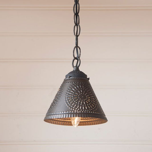 Vintage-style pendant light with decorative metal shade against a neutral background