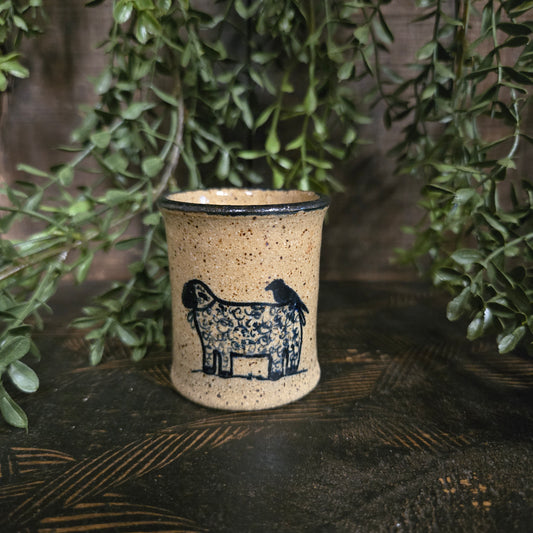 Miniature stoneware crock with a sheep with a crow perched on top