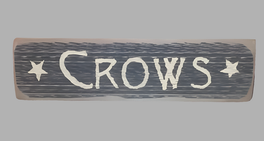 A wooden sign with the word 'CROWS' written in black and cream colors, surrounded by five stars.