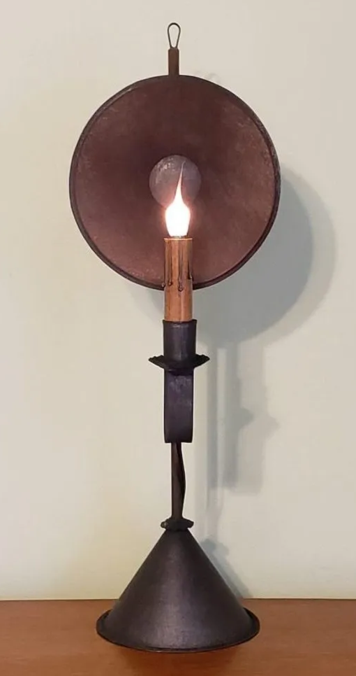 Decorative lamp with a light bulb inside on a plain background
