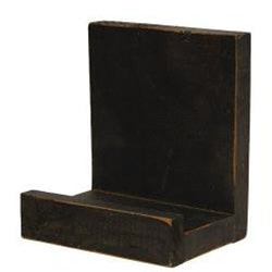 A distressed black wooden plate/frame holder with a tall back panel and short front panel.