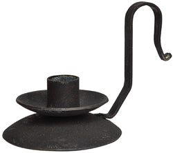 A black iron taper candle holder with a wax catcher and a curved strap handle, presented against a white background.