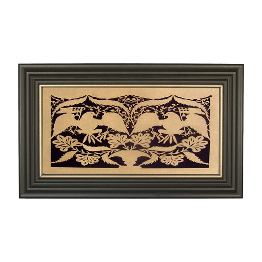 A framed paper cutting artwork featuring a geometric pattern with eagle silhouettes and floral elements, set against a black background with gold frame.