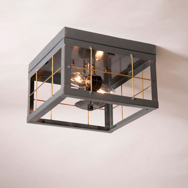 Ceiling light fixture with grid design on a plain background