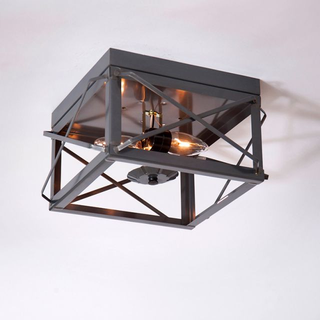 Ceiling light fixture with geometric design on a white background
