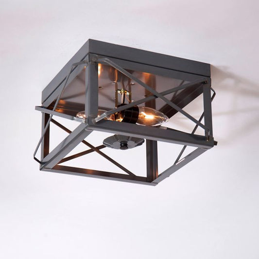 Ceiling light fixture with geometric design on a white background
