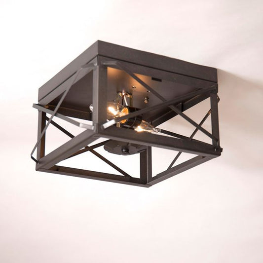 Modern black ceiling light fixture on a white background