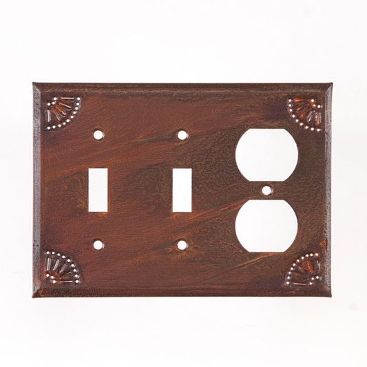Double switch with outlet in chisel pattern in rusty tin finish.