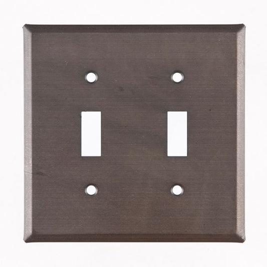 A kettle black double switch cover for wall plates, made of metal with a matte lacquer protective coating.
