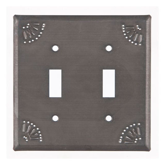 A black double switch cover with a matte finish and chisel marks around the edge.