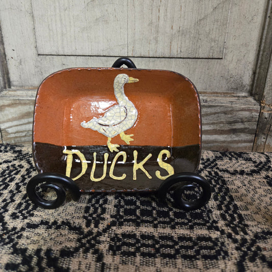 Small rectangular redware plate with the word 'Ducks'