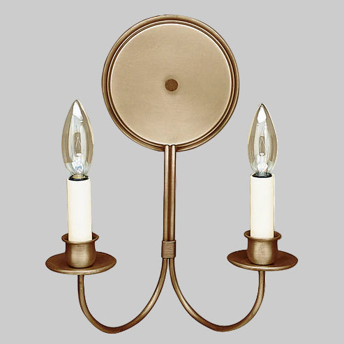 Bronze wall sconce with two candle-style light fixtures on a gray background