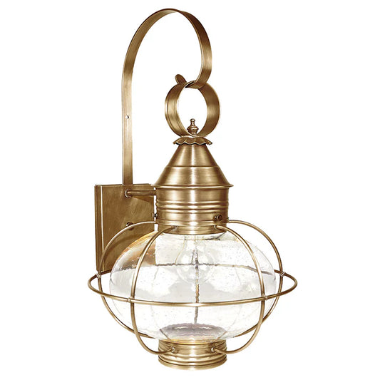 Brass wall-mounted lantern with glass shade on a white background