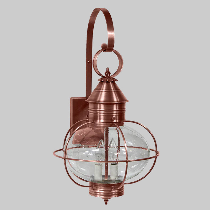 Copper outdoor wall light fixture with clear glass shade on a white background