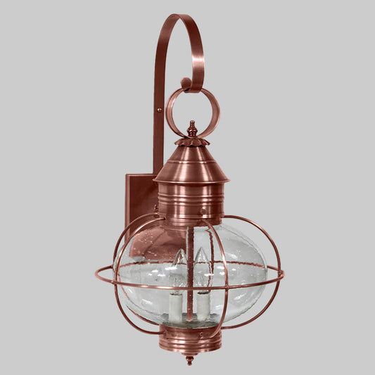 Copper outdoor wall light fixture with clear glass shade on a white background