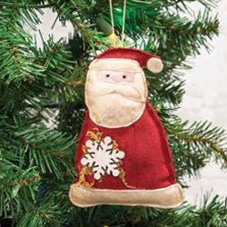 Santa ornament hanging on christmas tree