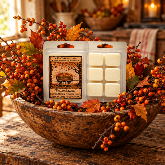 A wax melt package labeled 'Falling Leaves' by Salt Lake Breeze is displayed in a rustic wooden bowl surrounded by autumn leaves and orange berries. The package contains six off-white wax melts in a clear plastic clamshell.
