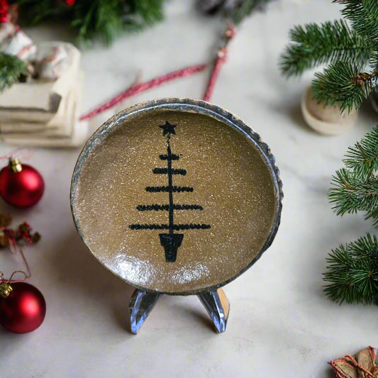 Decorative plate with a Christmas tree design on a festive background