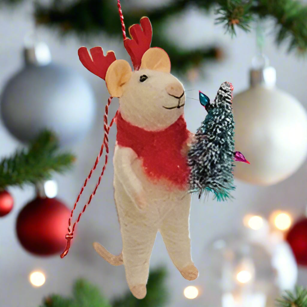 Felted mouse reindeer ornament holding bottle brush tree on white background