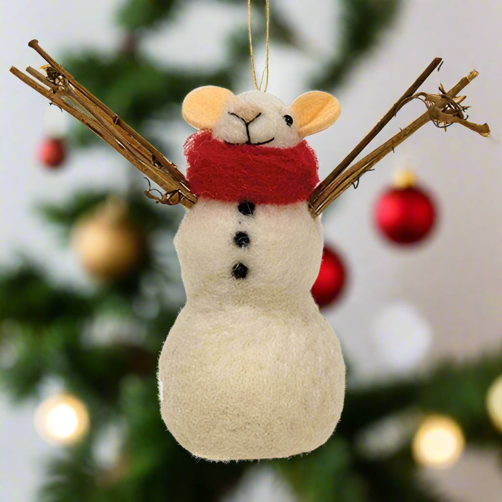 A plush felt snowman ornament with twig arms and a red scarf, designed as a Christmas decoration.