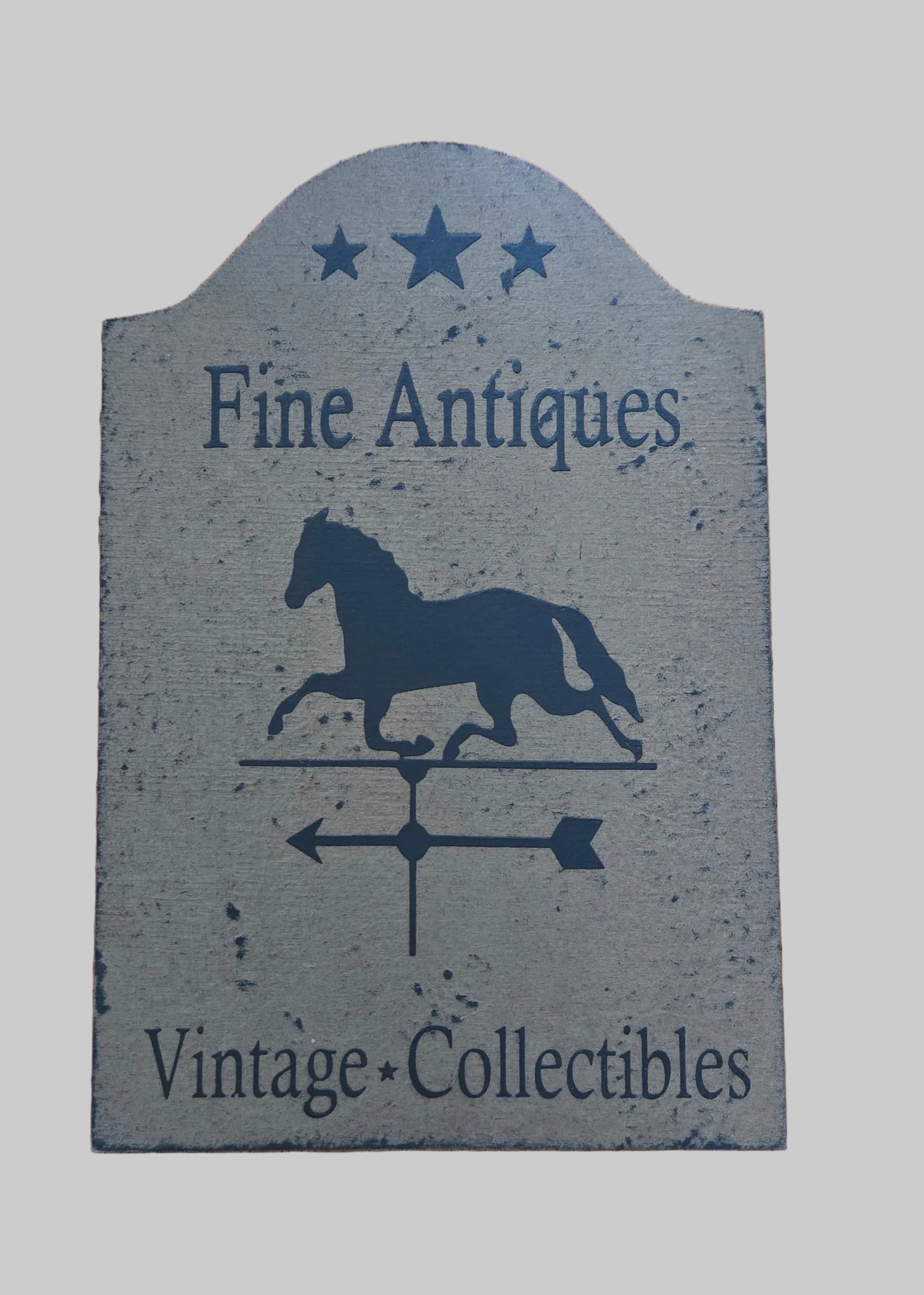 Decorative sign with horse silhouette and text 'Fine Antiques Vintage Collectibles' on a gray background
