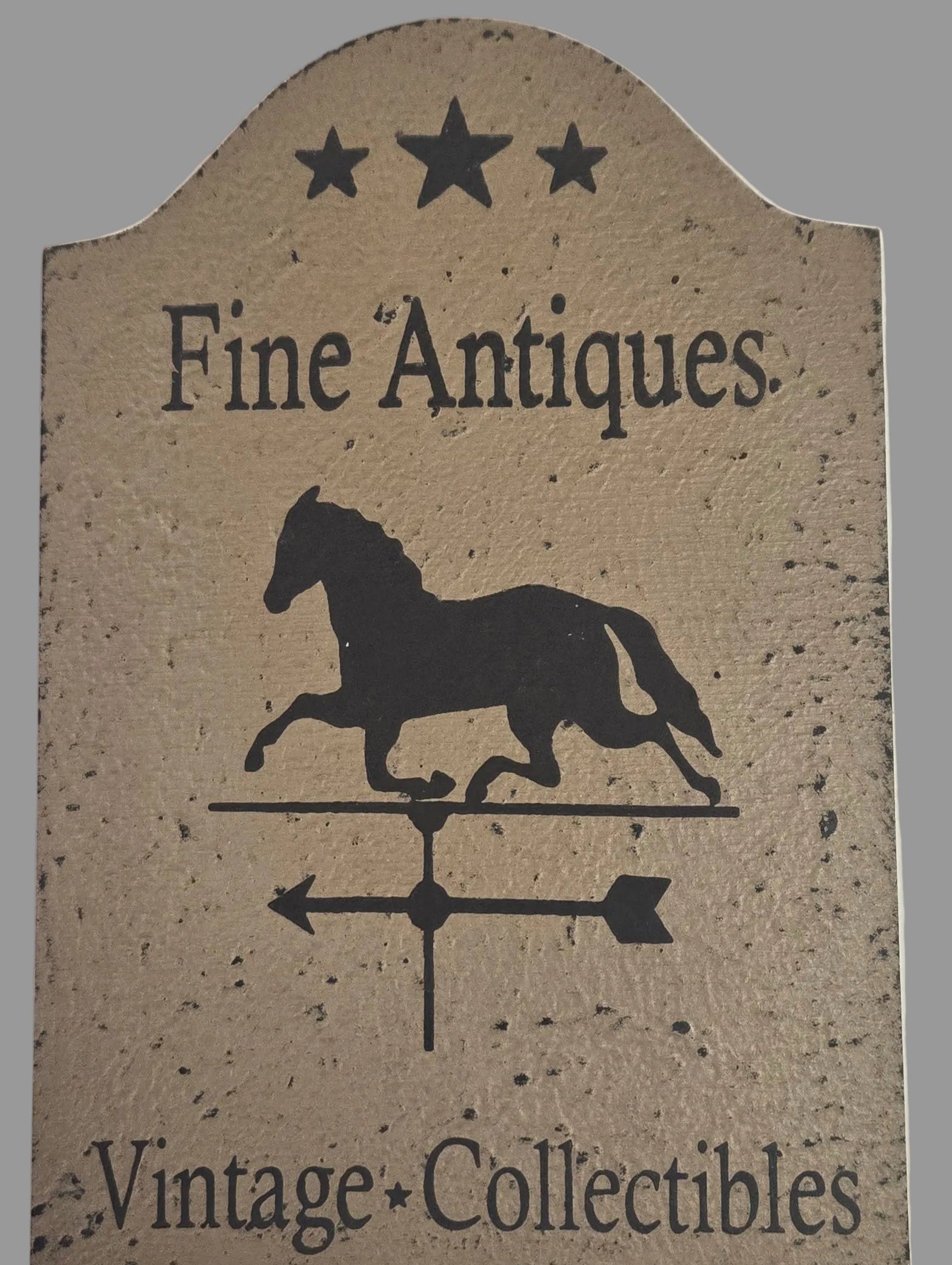 Decorative sign with 'Fine Antiques' and 'Vintage Collectibles' text, featuring a horse silhouette.