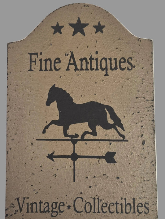 Decorative sign with 'Fine Antiques' and 'Vintage Collectibles' text, featuring a horse silhouette.
