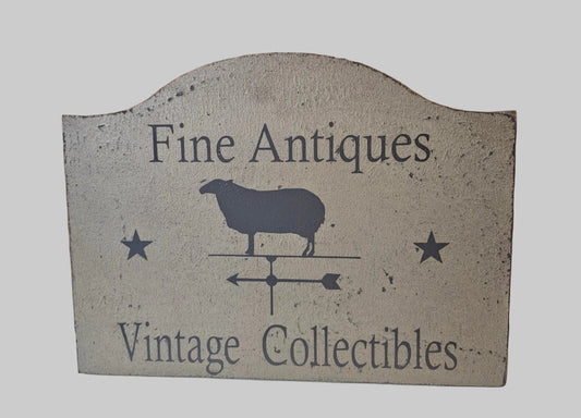 Vintage-style sign with 'Fine Antiques' and 'Vintage Collectibles' text on a gray background