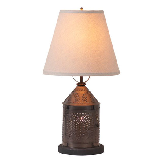 Decorative table lamp with a textured bronze base and beige lampshade on a white background