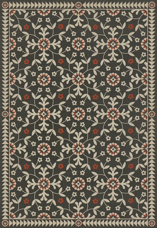 A rectangular vinyl floor cloth with a floral pattern, predominantly in shades of gray, black, and red.