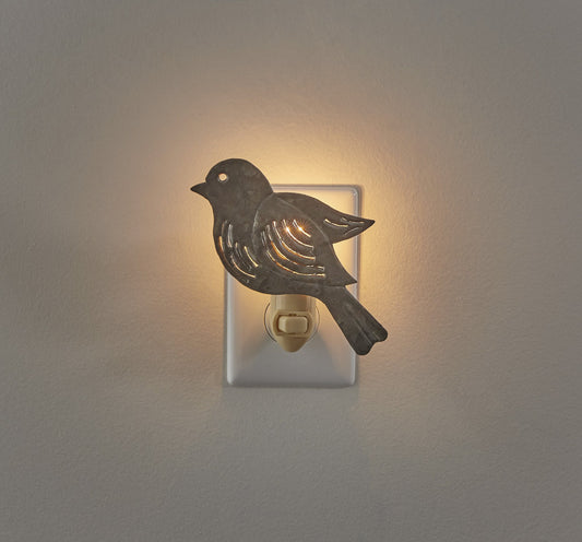 Galvanized bird night light on tan background