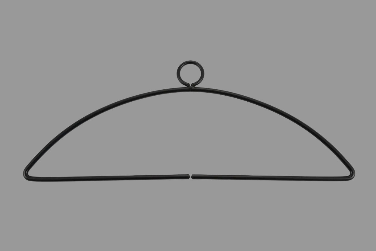 Black metal hanger on a gray background