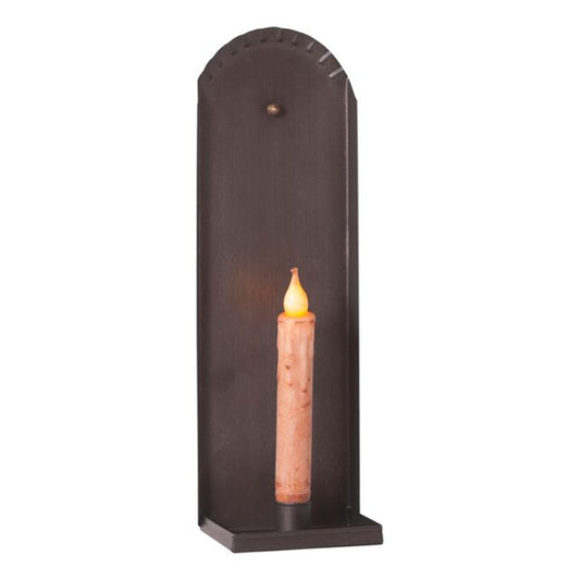 Tin candle sconce holding a battery operated taper on white background