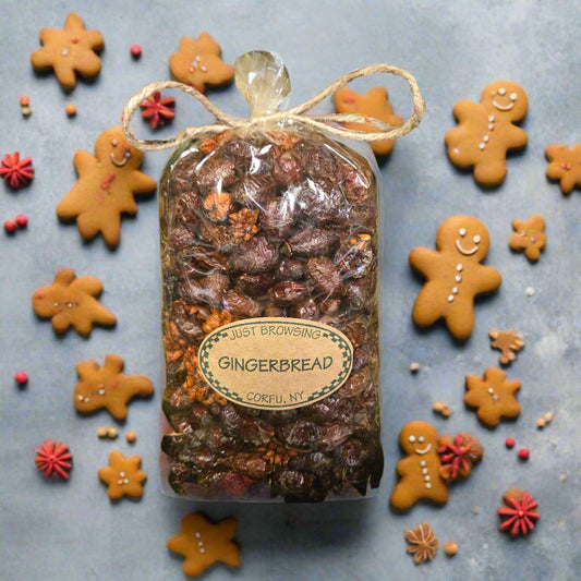 Gingerbread soap in a clear wrapper with a label on a green leafy background
