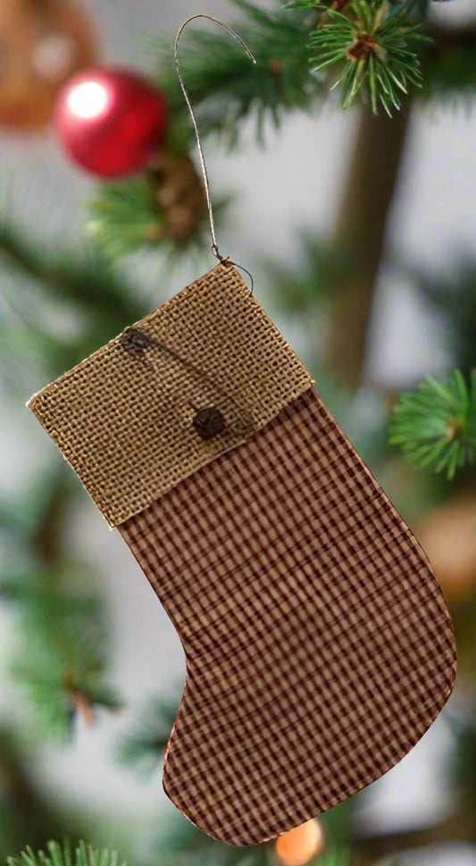 Brown checkered Christmas stocking ornament on a tree