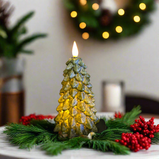A green LED tree-shaped candle with a flame on top, placed on a black plate, with a timer feature.