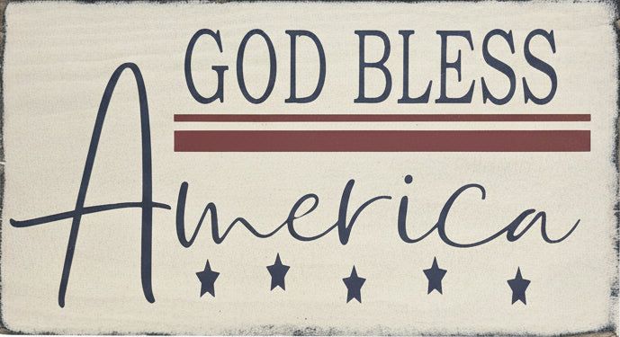 Wooden sign with 'God Bless America' text on a wooden surface