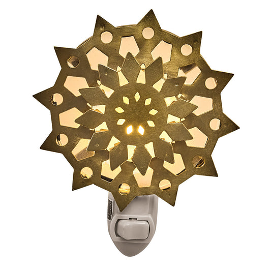 Gold snowflake nightlight on white background