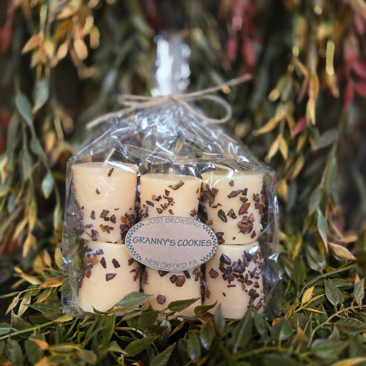 Packaged cookies with a visible brand label on a leafy background