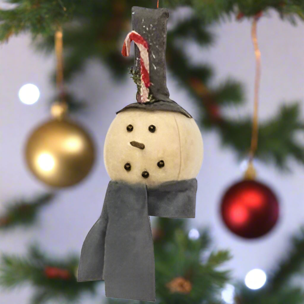 Plush snowman head ornament with a gray scarf and a tall gray top hat with a chenille candy cane and glitter, hanging on a fabric string.