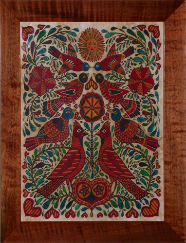 A colorful fraktur print featuring a circular design with birds and floral elements on a wooden background.