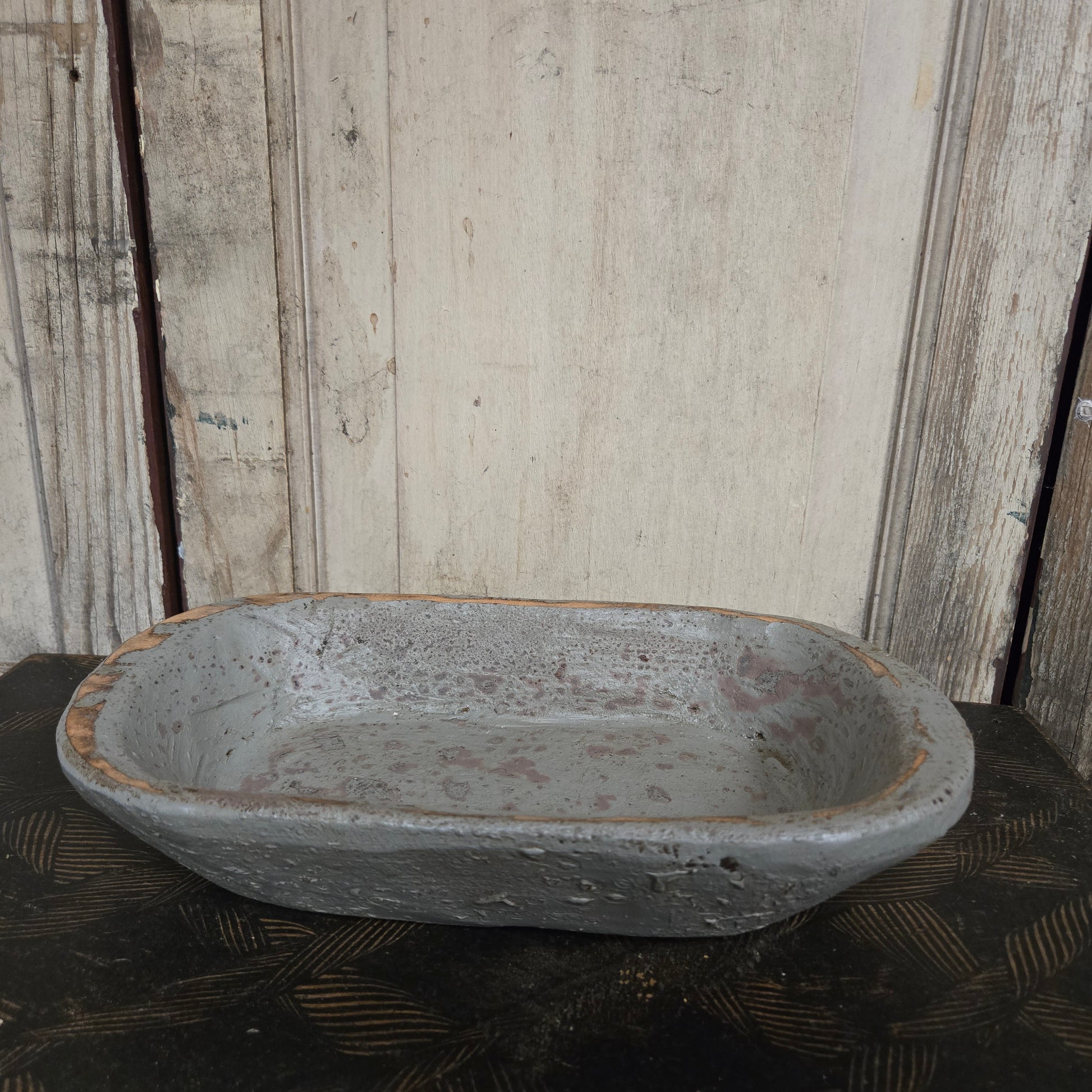 Vintage wood bowl on a textured surface