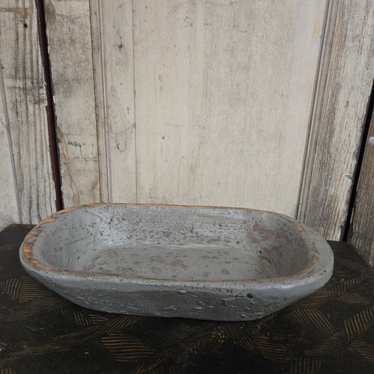 Vintage wood bowl on a textured surface
