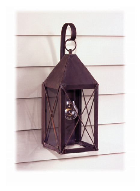 A bronze Grove wall light mounted on a house exterior, featuring a lantern design with a glass panel.