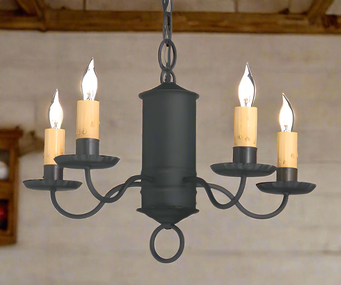 A Guilford wrought iron chandelier with five lights, featuring a black finish and a classic design, suitable for interior home lighting.