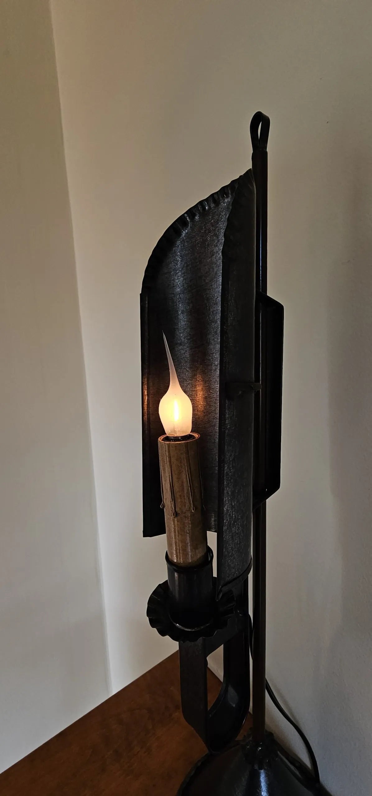 Side view of tin table light.