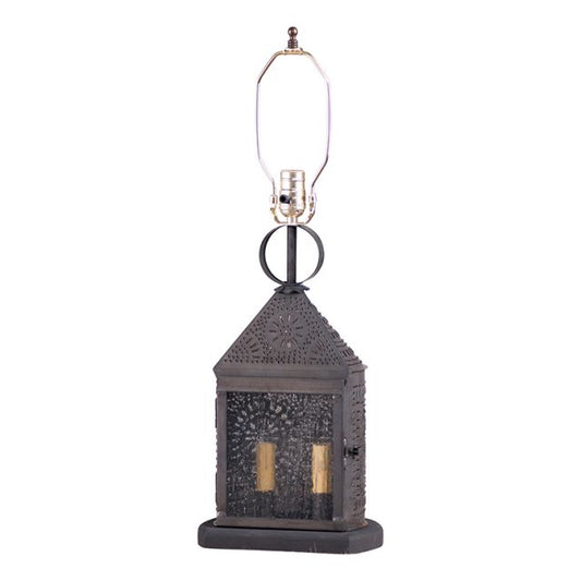 Tin lamp base that holds two candelabra bulbs inside and standard bulb on top with piercing on white background.