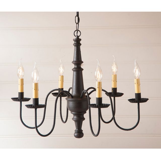 Black chandelier with six candle-style lights on a beige background